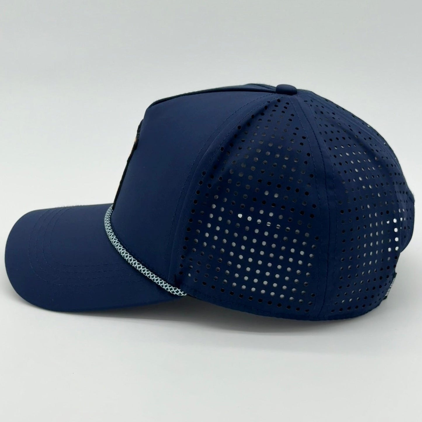 Navy blue Lion Rope Hat with mesh back on a light gray background